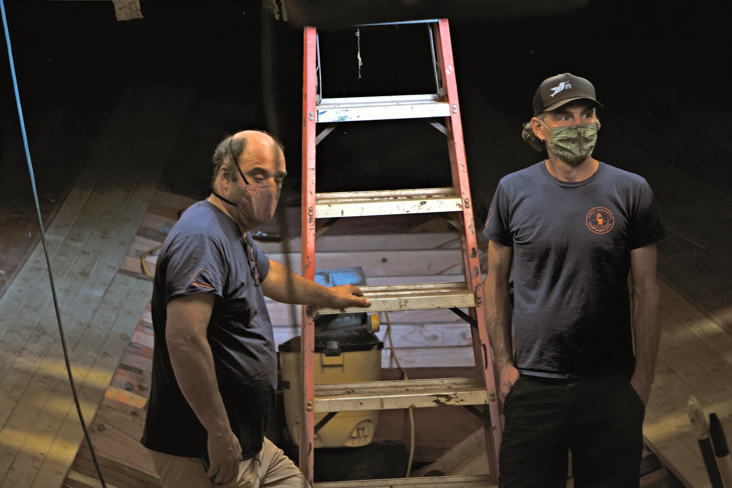 Tim Lee and Pete Rust survey the work below deck aboard the Western Flyer at the Port Townsend Shipwrights Co-Op.